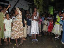 kids watching film in the street